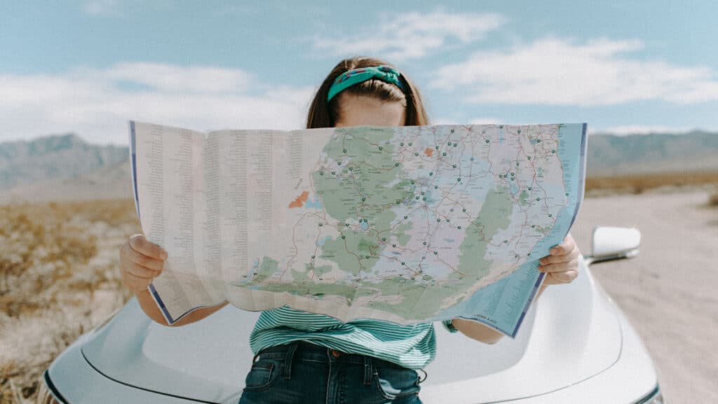 Young woman reading map