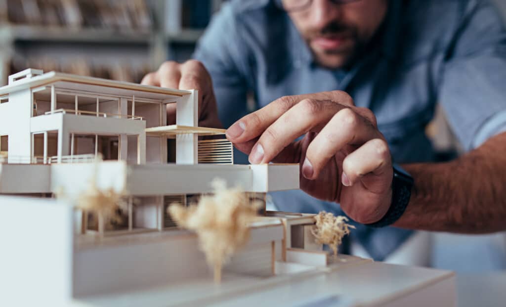 Architect with model of a house