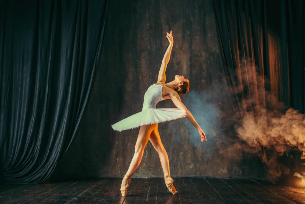 Ballerina strikes a pose with arm outstretched upwards