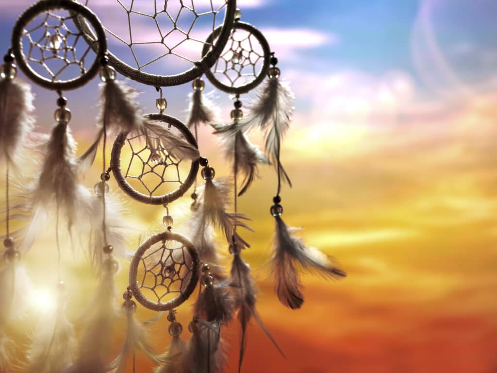 Indigenous dream catchers with colorful sky background