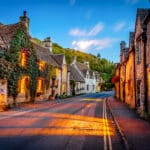 Quaint village - presumed to be European with shops and housing on each side of the street